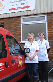 Carol Earner & Carol Swann, Directors of Phoenix Care At Home Ltd standing next to our wheelchair accessible hire vehicle